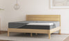 Emma Mattress Protector on a wooden bed frame — 100% waterproof, breathable and spill-proof protection for all Emma mattresses, compatible with all Indian bed sizes